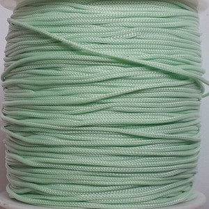 Polyester macrame thread 0.8mm pale green, slightly elastic, 10m wound on a spool