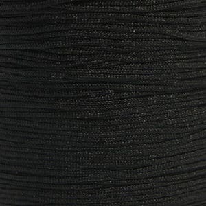 May include: A spool of black cord, a type of string used for crafts and other projects.