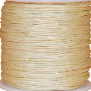 May include: A spool of cream-coloured waxed cord, ideal for crafting and jewellery making.