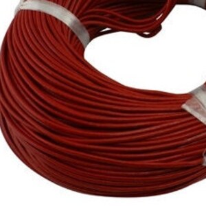 May include: A spool of red leather cord, ideal for crafting projects.