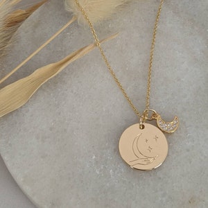 Crescent moon pendant gold necklace.