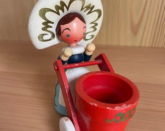 Tiny wheelbarrow lady
