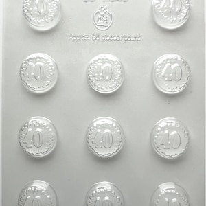 May include: Clear plastic mold with twelve circular cavities, each featuring the number "40" in a decorative font. The mold has the text "90-11640" and "Approx. 95 pieces/pound".