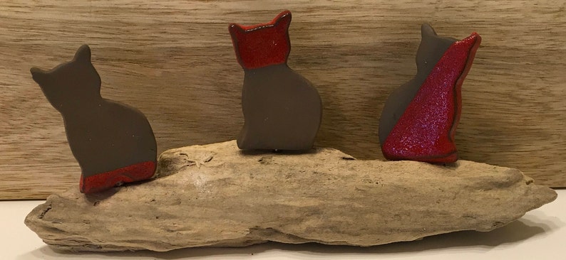 Three little enameled cats sitting on driftwood image 5