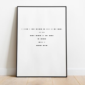 May include: A framed art print featuring a minimalist design in black and white. The artwork displays a series of horizontal lines and dots, resembling Morse code. The print is set against a white background, framed in a black frame, and rests on a wooden floor.