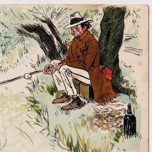 May include: A man sits under a tree, wearing a brown coat and a hat, smoking a pipe. He is fishing with a rod and has a bottle of alcohol and a box of snacks beside him.