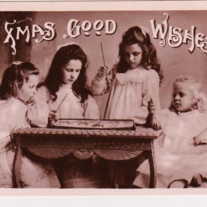 Dolci bambine che giocano a pesca, cartolina di NATALE antica con foto autentica, Davidson Bros, pubblicata nel 1907