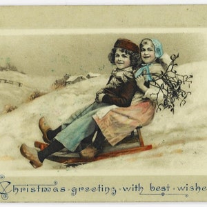 Dolci BAMBINI olandesi su SLITTA, vischio, neve, antica cartolina di Natale, adorabile moda invernale, pubblicata nel 1908