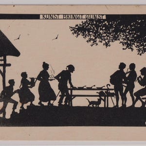 May include: A black and white silhouette art print depicting a gathering of people. The scene includes figures near a table, a cat, and musicians. The text "KUNST BRINGT GUNST" is at the top.