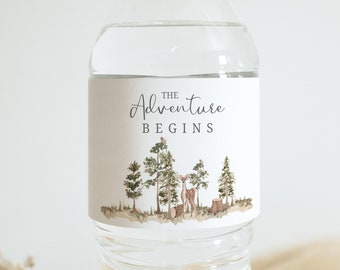 May include: Water bottle label with a watercolor illustration of a deer in a forest with the text "The Adventure Begins".