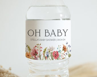 May include: Water bottle label with a floral design and the text "OH BABY STELLA'S BABY SHOWER | 08.24.24"