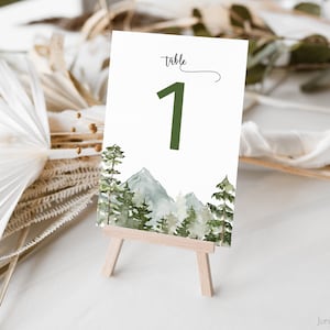 L'aventure commence en montagne avec des numéros de table | Numéros de table aquarelle forêt | Numéros de mariage des bois