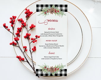 May include: A black and white checkered menu card with a festive Christmas theme. The menu features starters, main course, and dessert options. The card is decorated with a watercolor illustration of pine cones, holly, and greenery.
