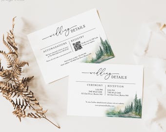 May include: Two white wedding details cards with elegant script and watercolour forest accents. One card lists accommodations and registry information, the other details the ceremony and reception times and locations.