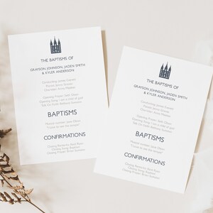 May include: Two white baptism announcement cards with dark blue text. The cards feature the text "The Baptisms of Grayson Johnson, Jaden Smith & Kyler Anderson" and include details about the baptism and confirmation. A sprig of dried foliage and a spool of thread are in the background.