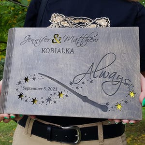 May include: A gray wooden wedding keepsake box with the names "Jennifer & Matthew" and the word "Always" engraved. The box features a wand design with star cutouts and the date "September 5, 2021".