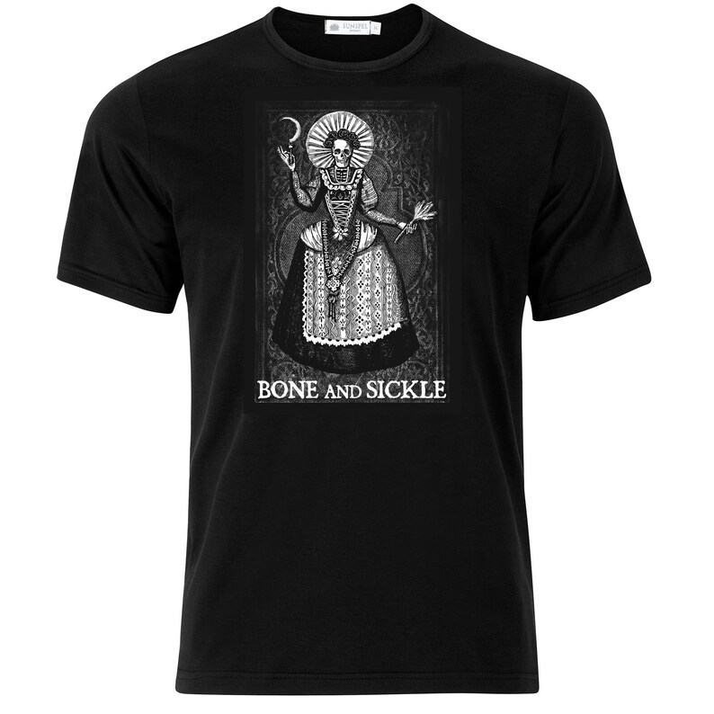 May include: A black short-sleeved t-shirt featuring a white graphic print of a skeleton dressed in a historical gown with a large ruff collar, holding a crescent moon and a sickle. The text BONE AND SICKLE is printed in white below the figure.