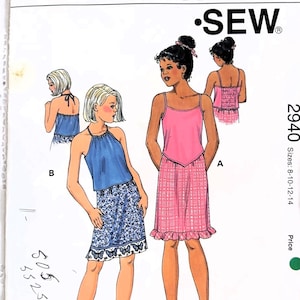May include: A sewing pattern for a girls' dress and top. The pattern is called "Kwik Sew" and the pattern number is 2940. The pattern includes sizes 8-10-12-14.