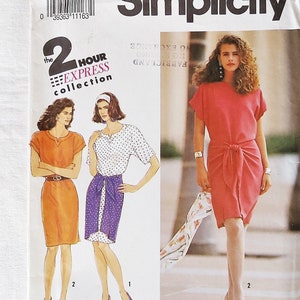 May include: Simplicity sewing pattern number 7213 for a dress with short sleeves and a tie at the waist. The pattern is for sizes 12-18 and includes instructions for making the dress in two different styles.