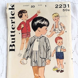 May include: A vintage Butterick sewing pattern envelope 2231 for children's clothing, featuring illustrations of four outfits including a striped jacket and shorts set, a red cardigan with plaid shorts, a vest with shorts, and a shirt with suspender shorts.