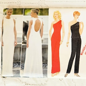 May include: A sewing pattern for three different dresses. The first dress is white with a low back, the second dress is red with a one-shoulder neckline, and the third dress is black with a one-shoulder neckline and matching trousers. The pattern is for sizes 6-8-10-12. The pattern is from Butterick and is labelled "Fabricland No Exchange Or Refund On Patterns".