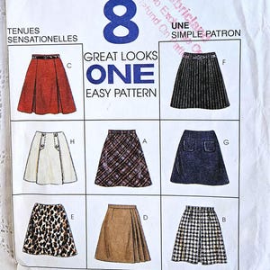 May include: A McCall's sewing pattern with eight skirt designs. The pattern includes a pleated skirt, a denim skirt, and a plaid skirt. The package is white with the number 8 in blue and the text "Great Looks One Easy Pattern". Measurements are in centimeters.