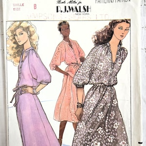 May include: Vintage sewing pattern for a dress with a V-neck, long sleeves, and a tie belt. The pattern is by Quick! Butterick and is for size B. The pattern is for a dress with a floral print and a solid color.