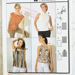 May include: A Burda pattern for tops, featuring four different top designs. The pattern includes European sizes 34-44 and sizes 8-18. The cover displays images of the tops and includes the text "TOP HAUT".