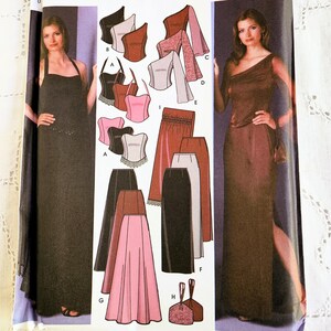 May include: Simplicity sewing pattern number 301 for sizes 39-44 and 40-46. The pattern includes instructions for making a variety of garments, including a black halter top, a pink and black skirt, a brown top with a one-shoulder neckline, and a black and brown corset.
