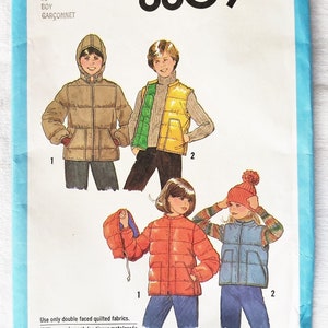 May include: Simplicity sewing pattern number 8809 for a boy's quilted jacket and vest. The pattern includes instructions for making a hooded jacket, a vest, and a puffer jacket. The pattern is for sizes 10.