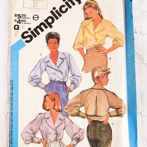 May include: A sewing pattern for a double-breasted jacket with a collar and long sleeves. The pattern is from Simplicity and has the number 6549 on it. The pattern shows three different styles of the jacket.