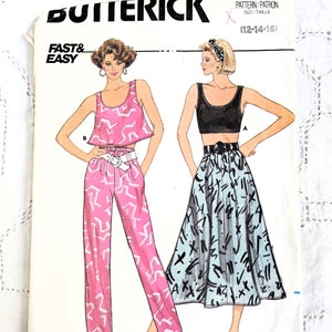 May include: A vintage sewing pattern for a women's top and skirt. The pattern is from Butterick and is for sizes 12-14-16. The top is a cropped tank top with a scoop neck and the skirt is a full skirt with a waistband. The pattern is printed on white paper with black and pink illustrations.