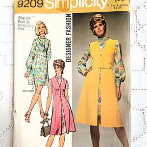 May include: Vintage Simplicity sewing pattern number 9209 for a mini-length dress. The pattern is for size 12, bust 34 inches, waist 25 1/2 inches. The pattern shows two different styles of dresses, one with a yellow bodice and floral print skirt, and the other with a pink bodice and floral print skirt.