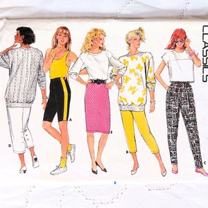 May include: A sewing pattern for four different outfits. The pattern is from Butterick and is number 4862. The outfits include a white sweater with a black and white pattern, a yellow tank top with black and yellow shorts, a pink skirt with a white sweater, and black and white pants with a white shirt.