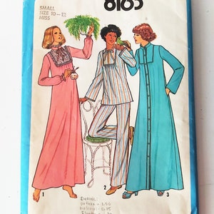 May include: Simplicity sewing pattern number 8163 for a small size 10-12 miss. The pattern includes three different styles of long dresses: a pink dress with lace trim, a striped pajama-style dress, and a blue dress with buttons down the front.
