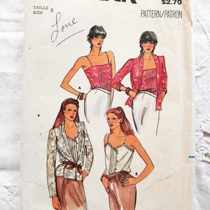 May include: A vintage sewing pattern for a women's top and skirt. The pattern is from Butterick and is number 3131. The pattern is for size 8 and costs $2.70.