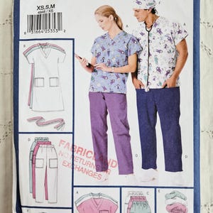 May include: Butterick sewing pattern 4946 for professional uniforms. The pattern includes diagrams of scrubs and accessories. The cover features a woman and a man wearing scrubs. The scrubs are blue and purple with a cartoon design.