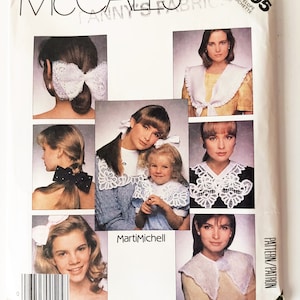 May include: McCall's sewing pattern number 3205 for a lace collar. The pattern includes instructions for making a variety of collars, including a simple collar, a ruffled collar, and a lace collar. The pattern is designed by Marti Michell.