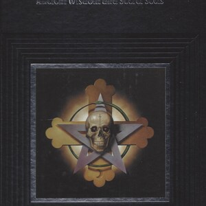 May include: A black book with the title "Ancient Wisdom and Secret Cults" on the cover. The cover features a gold and purple star with a skull in the center, surrounded by a green snake.