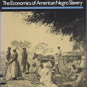 May include: A black and white photo of a group of people working in a field. The photo is from the book "Time on the Cross: The Economics of American Negro Slavery" by Robert William Fogel and Stanley L. Engerman.