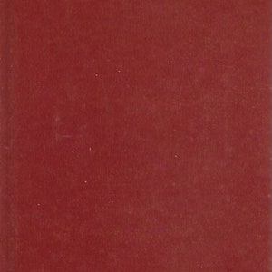 May include: A red book cover with gold lettering. The title is "Out of Africa" by Isak Dinesen.