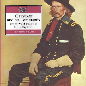 May include: A book cover featuring a portrait of General George Armstrong Custer in his military uniform. The title of the book is "Custer and his Commands: From West Point to Little Bighorn" by Kurt Hamilton Cox.