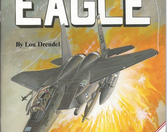 May include: A gray and black F-15 Eagle fighter jet flying through the air with a yellow and orange background. The text "MODERN MILITARY AIRCRAFT" and "EAGLE" are at the top of the image. The text "By Lou Drendel" is below the jet. The text "squadron/signal publications" is at the bottom of the image. The text "REVISED 8 Extra Pages" is in a red box in the lower right corner of the image.
