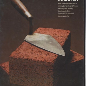 May include: A close-up of a trowel resting on top of a stack of red bricks. The book cover in the background reads "MASONRY" with the text "Walls, Sidewalks and Patios, Mixing Concrete and Mortar, Patching and Pointing, Building with Brick, Forms and Foundations, Working with Tile".