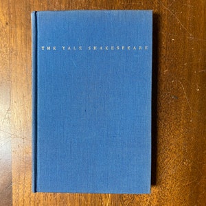 May include: A blue hardcover book with the text "THE YALE SHAKESPEARE" printed in white on the spine.