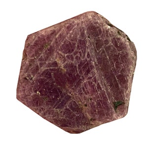 May include: A deep red ruby crystal with a hexagonal shape and a rough, textured surface.
