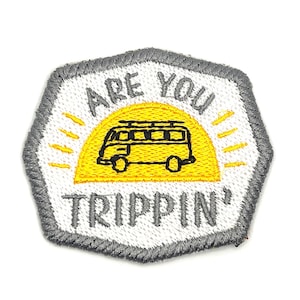May include: Embroidered patch with a white background and a gray border. The patch features a yellow sun with a yellow van in front of it. The text "ARE YOU TRIPPIN'" is embroidered in gray.