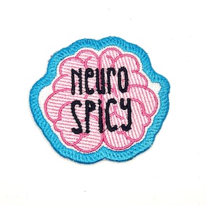 May include: A blue and pink embroidered patch with a brain shape and the text "Neuro Spicy".