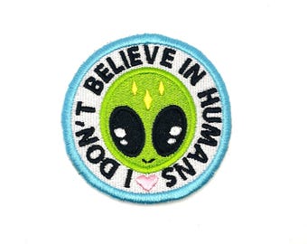 I don’t believe in humans - Embroidered Iron On or Sew On Patch - Funny - Snarky UFO Alien