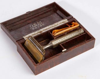 Aparelho de barbear de segurança vintage GEM Micromatic com lâminas na caixa original de baquelite.